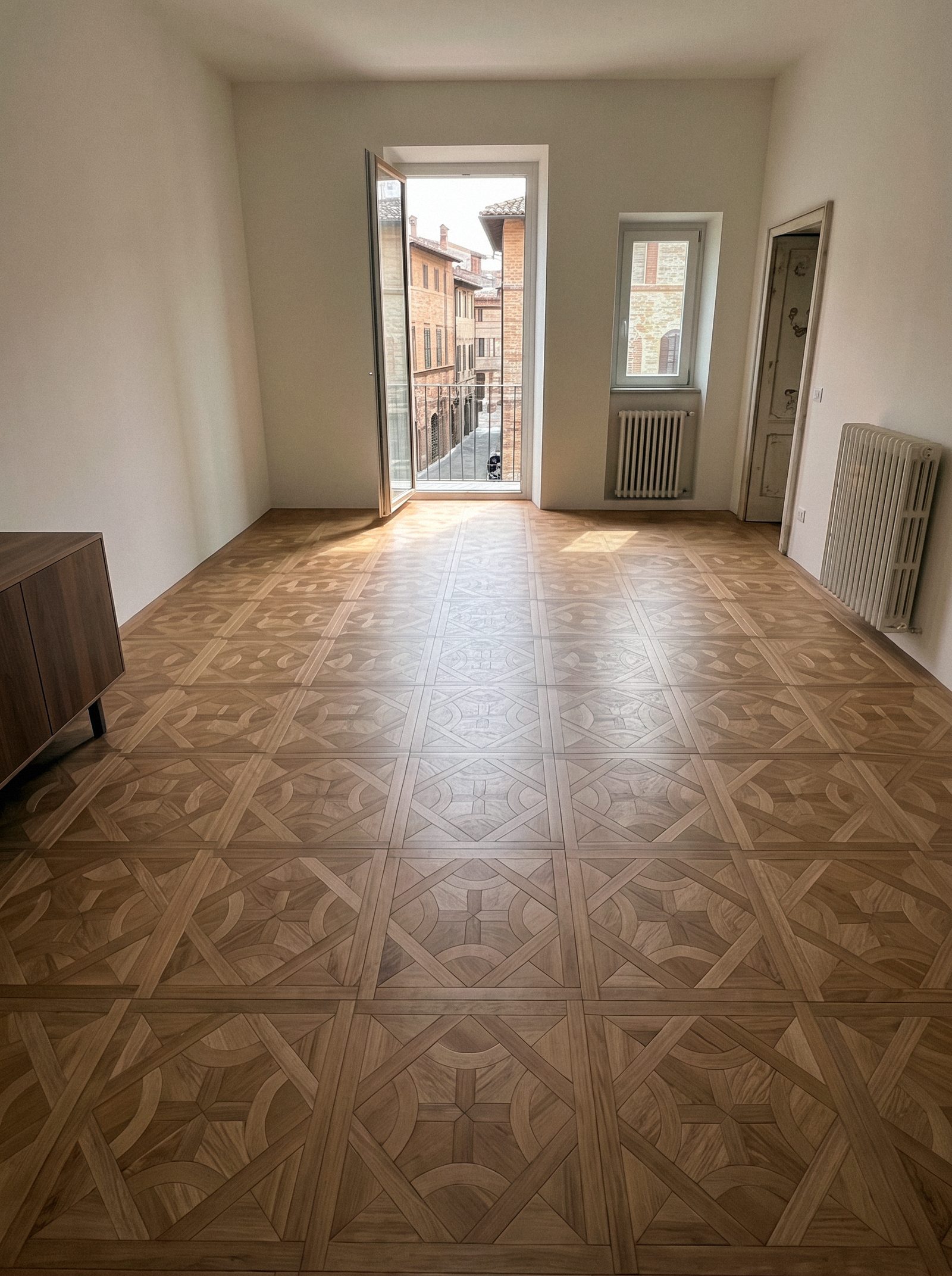 Parquet Versailles in rovere chiaro posato in ambiente